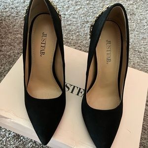 Black heels with gold accessories